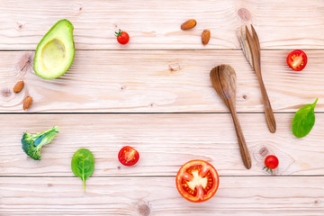 Food background and salad concept with raw ingredients  flat lay on white wooden background.