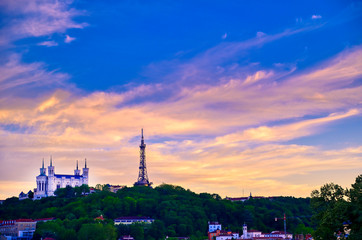 Lyon, France and the Basilica of Notre-Dame de Fourvière at sunset.