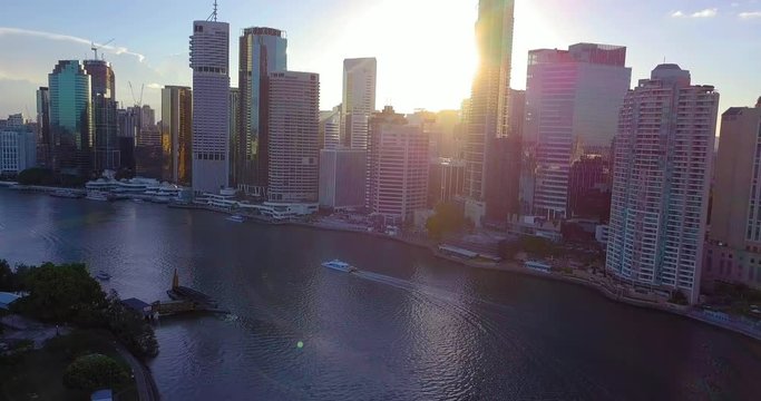 AERIAL DOLLY IN shot of a sunrise view of Brisbane city, Australia