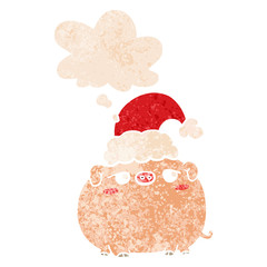 cartoon pig wearing christmas hat and thought bubble in retro textured style