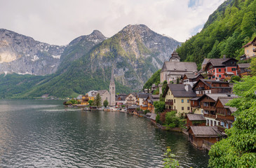 Fototapeta na wymiar Panoramic lake with mountain and Hallstatt village in summer, famous landmark and travel destination in Austria