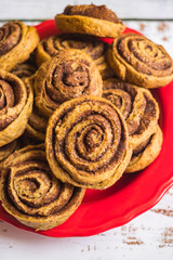 Cinnamon roll or cinnamon bun - sweet baked dessert with spices, flour, sugar and butter.
