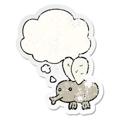 cartoon fly and thought bubble as a distressed worn sticker