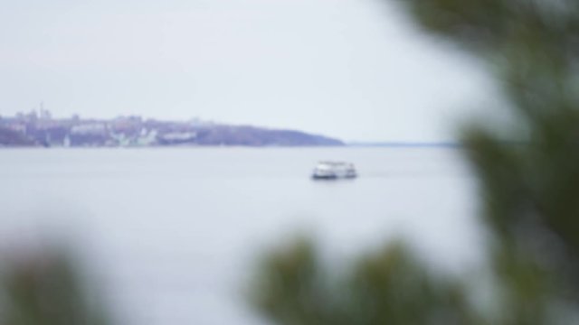 White yacht at river in city, luxury lyfe. Stock footage. View of the yacht on the river