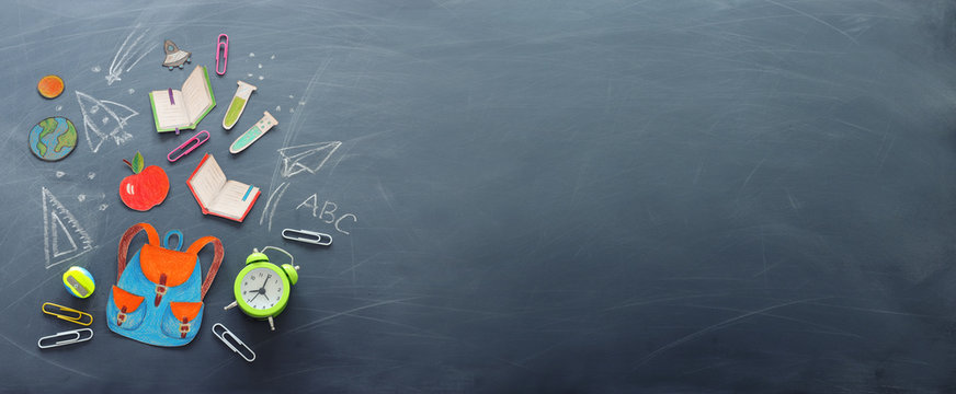 Education And Back To School Concept. Shapes Cut From Paper And Painted Of Backpack, Books, Chemistry Flask And Apple Over Classroom Blackboard With Funny Sketches. Top View, Banner