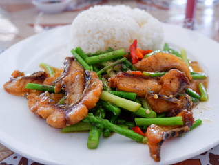 stir fried fish crispy and asparagus cooked rice on plate