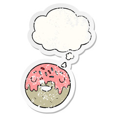 cartoon donut and thought bubble as a distressed worn sticker