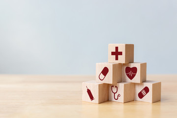 Wood block stacking with icon healthcare medical, Insurance for your health concept