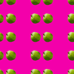 Seamless pattern of green apples on pink background