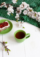 A tasty break: a cup of tea with a rye bread sandwich.
