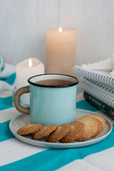 Fototapeta na wymiar A study break: a mug of tea with cookies on a side.