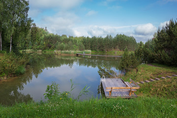 City Amatciems, Latvian republic. A clean lake and surrounded by green nature. Recreation area for tourists. Travel photo 14. Jun. 2019