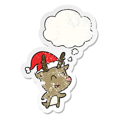 cartoon christmas reindeer and thought bubble as a distressed worn sticker