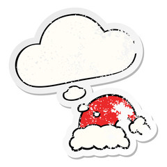 cartoon christmas hat and thought bubble as a distressed worn sticker