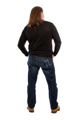 Brutal middle-aged adult man in full growth back. Vertical. Isolated on a white background.