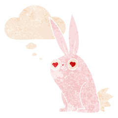 cartoon bunny rabbit in love and thought bubble in retro textured style