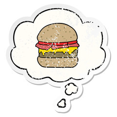 cartoon burger and thought bubble as a distressed worn sticker