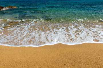 Wave of the sea on the sand beach