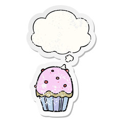 cartoon cupcake and thought bubble as a distressed worn sticker