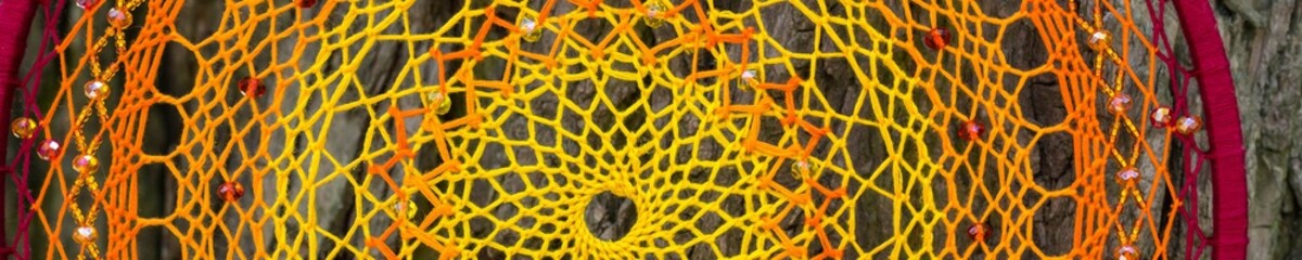 Banner of Handmade dream catcher with feathers threads and beads rope hanging