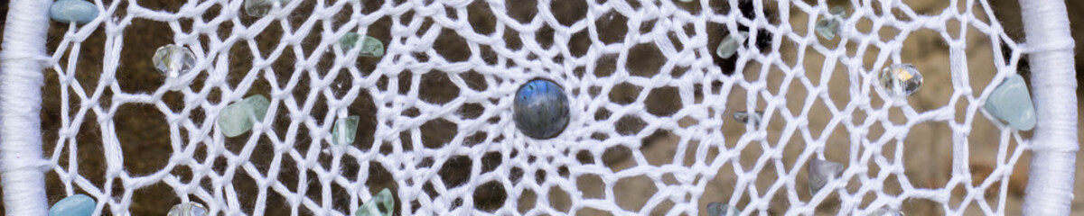 Banner of Handmade dream catcher with feathers threads and beads rope hanging