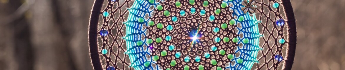 Banner of Handmade dream catcher with feathers threads and beads rope hanging