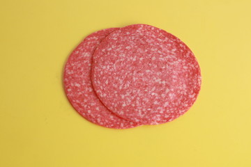 slices of salami in colorful background