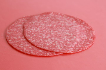 slices of salami in colorful background