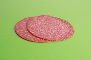 slices of salami in colorful background