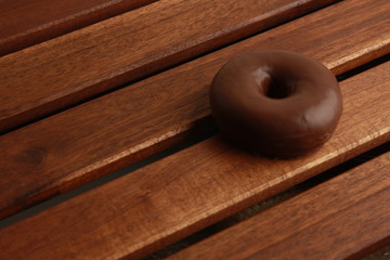 chocolate bagel on wooden background