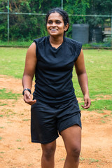 beautiful sporty indian athlete woman playing football