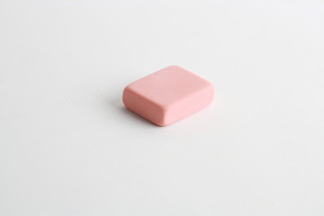 pink eraser on colorful background