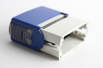 Automatic ink stamp manufactured in blue plastic