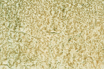 Grunge old painted wall of the house close up green color toned. Abstract background