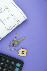 Buying a house, building repair and mortgage concept. Estimation real estate property with loan money and banking. Plan of a house, keys and calculator on trendy purple background. 