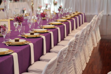 Serving a table at a wedding celebration