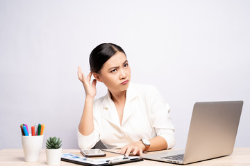 Woman scratching her head at office isolated white background