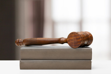 Law and justice concept image. Brown wooden background