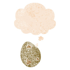 cartoon egg and thought bubble in retro textured style