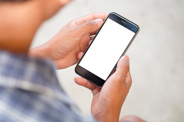 Cropped shot view of man hands holding smart phone with blank copy space screen for your text message or information content, female reading text message on cell telephone during in urban setting.