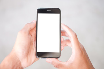 Cropped shot view of man hands holding smart phone with blank copy space screen for your text message or information content, female reading text message on cell telephone during in urban setting.