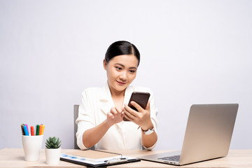 Portrait of happy woman used smartphone at office isolated over background