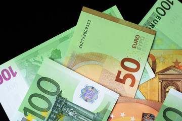 One Hundred and Fifty euro banknotes green color toned close up