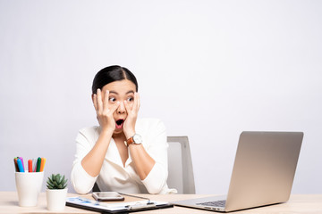 Portrait of a woman feel scared sitting at office isolated over background