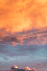 Dramatic orange sky with clouds at sunset. It can be used as a background