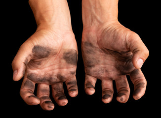 Fototapeta premium dirty hands after work on a black background
