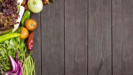 Fotobehang Different vegetables on wooden background. Healthy eating concept. Top view. © vasanty