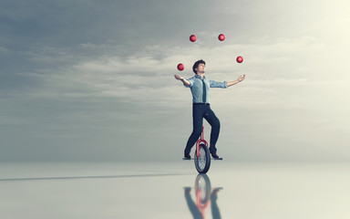 Juggling on unicycle © Orlando Florin Rosu