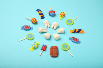Teeth with sweet candies. Tooth caries in children's, dental healthcare.