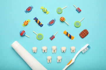 Teeth with sweet candies. Tooth caries in children's, dental healthcare, toothpaste and toothbrush.